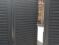 Чёрные откатные ворота с отдельностоящей калиткой